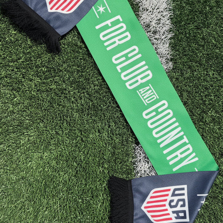 Green and navy scarf with USAF logo on grass