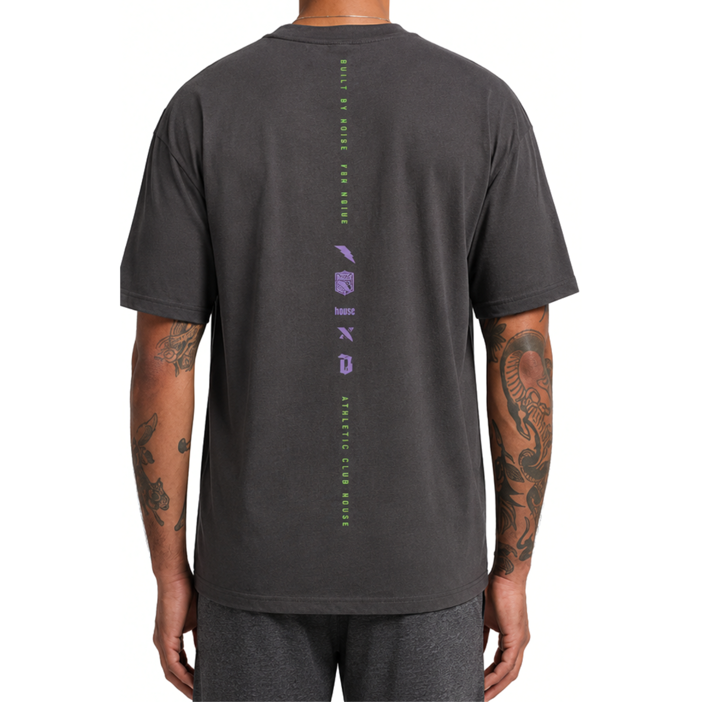 Person wearing a dark gray t-shirt with a logo on the back against a white background