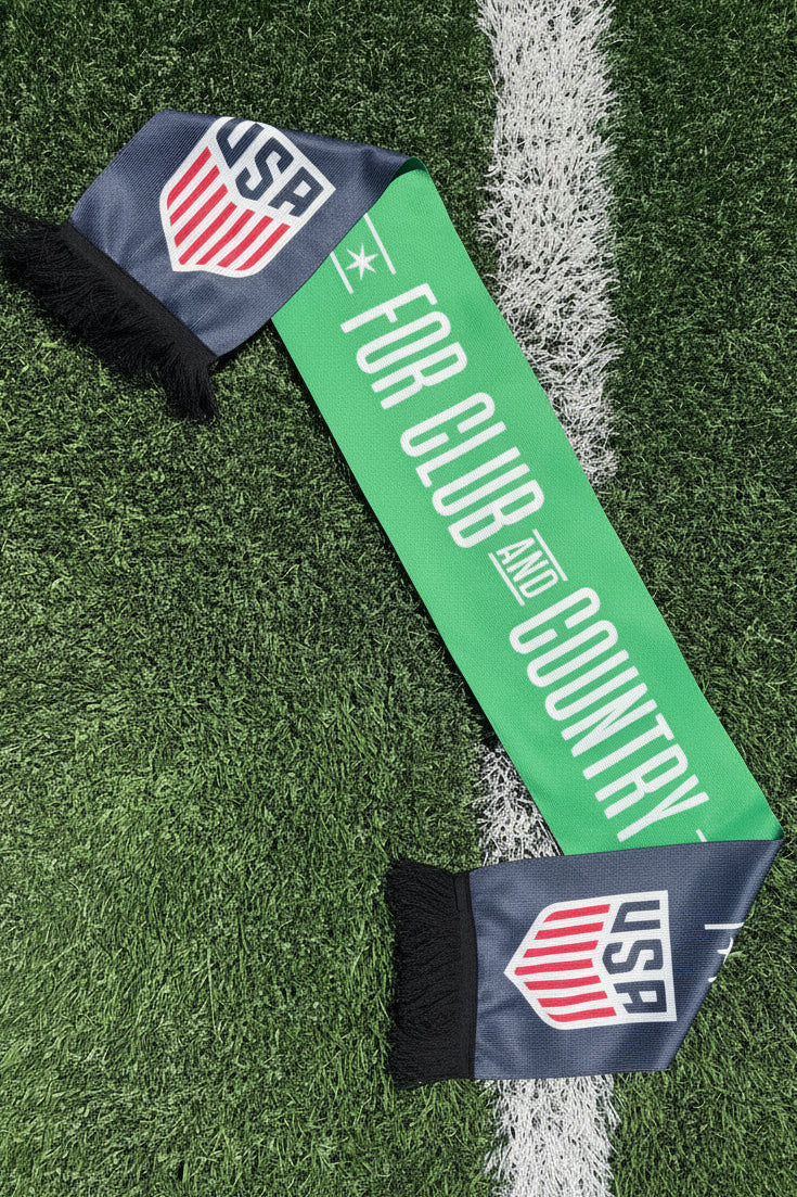 Green and navy scarf with USAF logo on grass