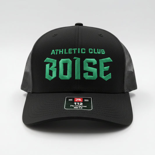 Black hat with green text

