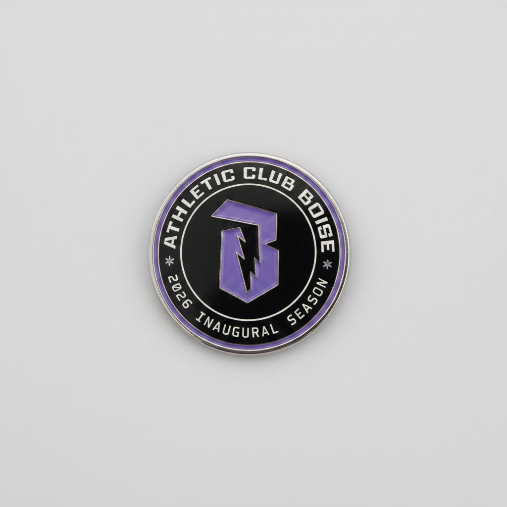 Round logo with 'Athletic Club Boise' text on a reflective surface