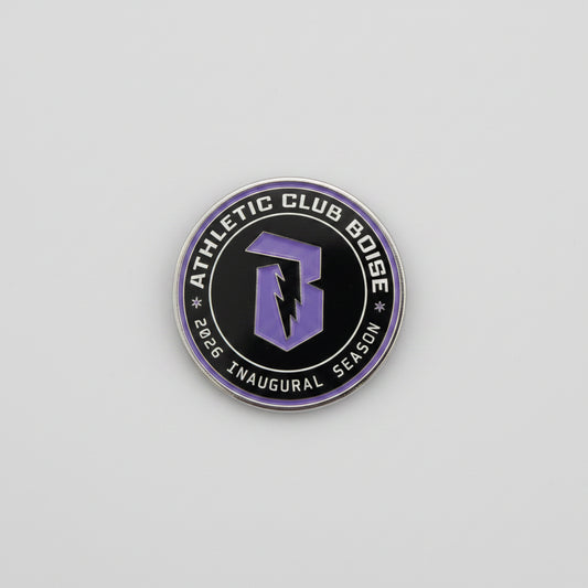 Round logo with 'Athletic Club Boise' text on a reflective surface