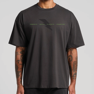 Person wearing a black t-shirt with text on a gray background
