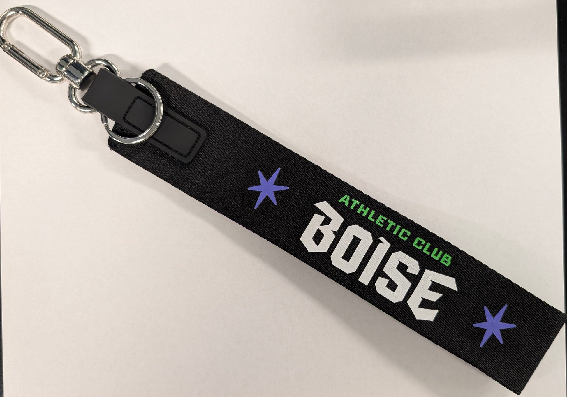 Black keychain with 'Boise Athletic Club' text on a light gray background